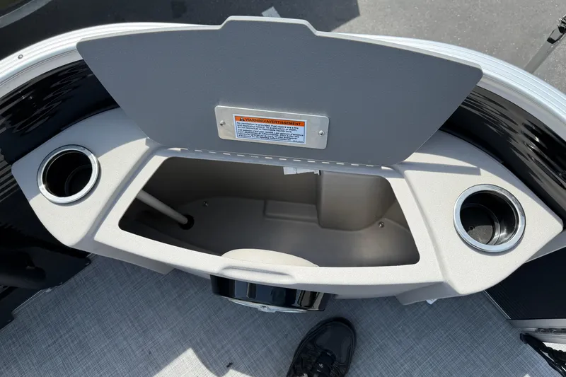 Slide: The Image of 2025 Princecraft Sportfisher 21-2S boat storage compartment with cup holders. - 9