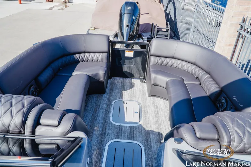 Slide: The Image of 2025 Bennington 25QSBWA pontoon boat interior with luxurious seating at Lake Norman Marina. - 12