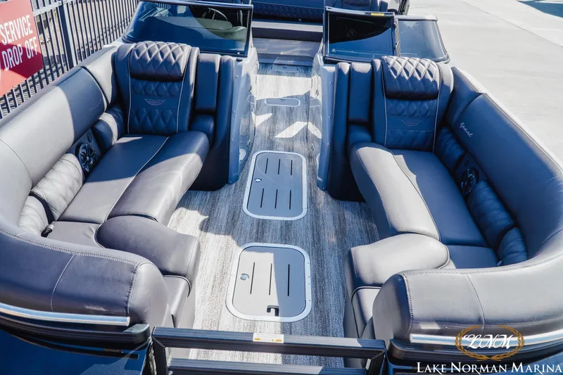 Slide: The Image of Luxurious interior of 2025 Bennington 25QSBWA pontoon boat with plush seating. - 13