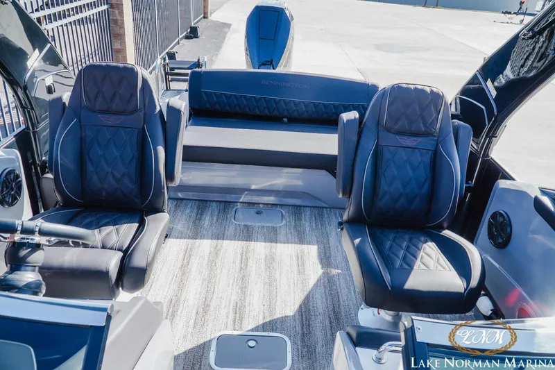 Slide: The Image of 2025 Bennington 25QSBWA boat interior with luxurious seating and modern design. - 17