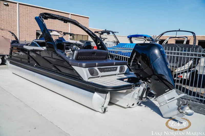 Slide: The Image of 2025 Bennington 25QSBWA pontoon boat with Mercury outboard at Lake Norman Marina. - 3