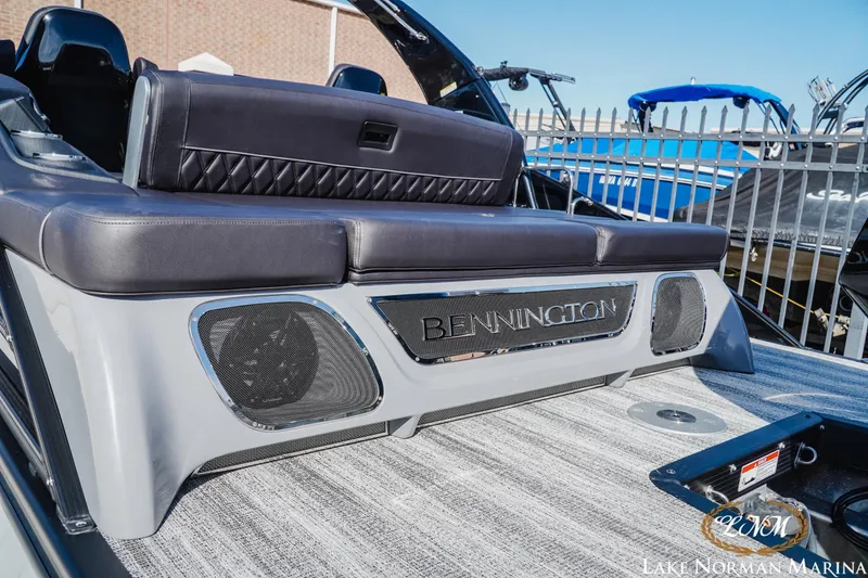 Slide: The Image of 2025 Bennington 25QSBWA boat with luxurious seating at Lake Norman Marina. - 4