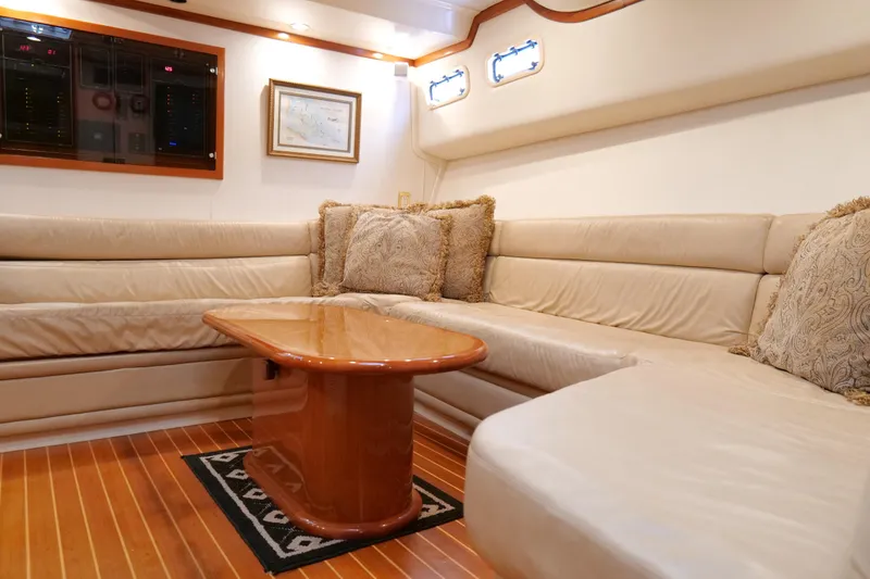 Slide: The Image of Luxurious interior of a 1998 Cabo 45 Express yacht with plush seating and elegant decor. - 29