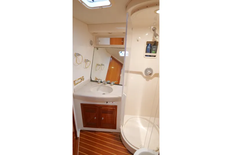 Slide: The Image of Luxurious bathroom in 1998 Cabo 45 Express yacht with shower and vanity. - 32