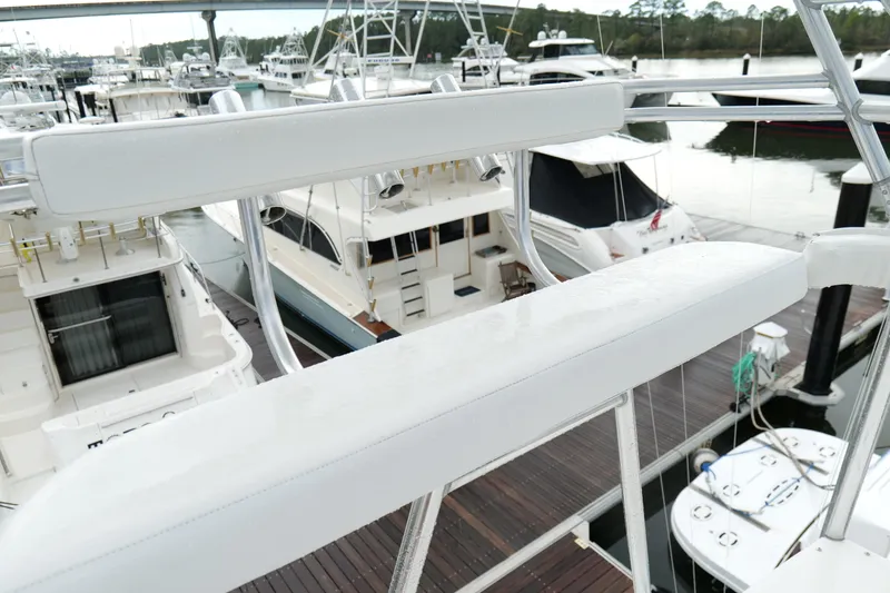 Slide: The Image of Cabo 45 Express 1998 yacht docked at marina with other boats. - 37