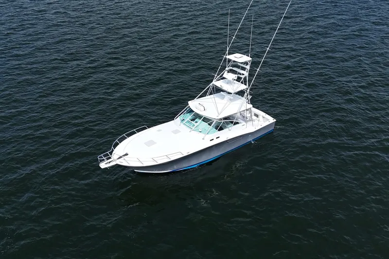 Slide: The Image of Aerial view of 1998 Cabo 45 Express boat on open water. - 54