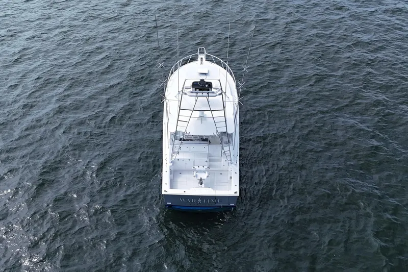 Slide: The Image of Aerial view of 1998 Cabo 45 Express boat on open water. - 55