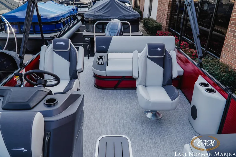 Slide: The Image of 2026 Bennington 22SSB pontoon boat interior with modern seating at Lake Norman Marina. - 14