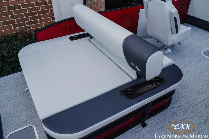 Slide: The Image of 2026 Bennington 22SSB boat interior with comfortable seating and cup holders at Lake Norman Marina. - 5