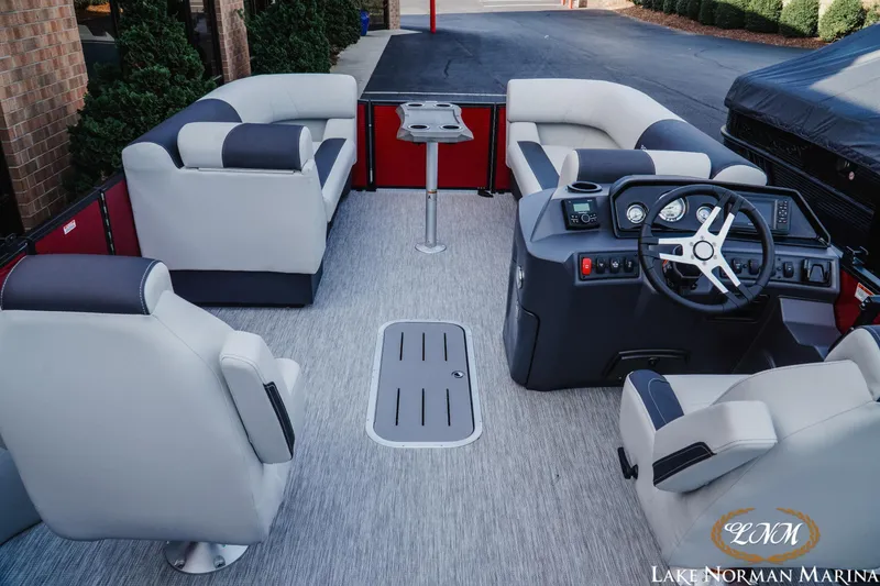 Slide: The Image of 2026 Bennington 22SSB pontoon boat interior with plush seating and modern helm. - 6