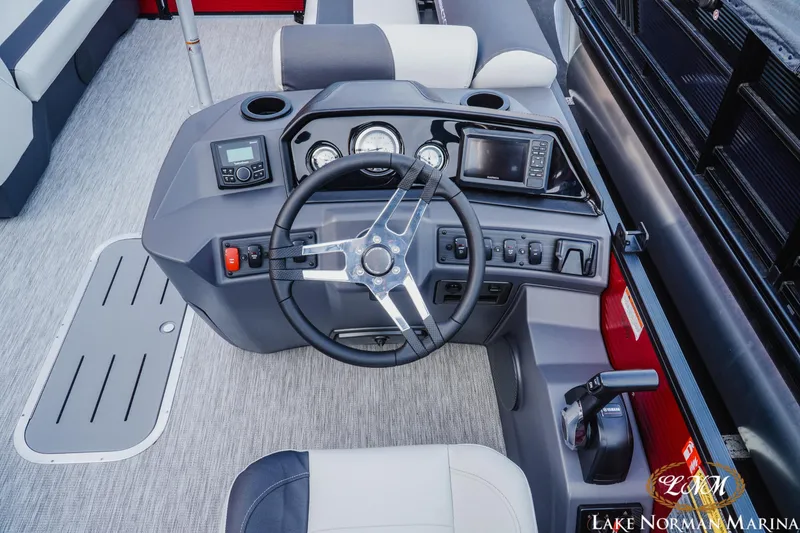 Slide: The Image of Cockpit of 2026 Bennington 22SSB boat with steering wheel and control panel. - 8
