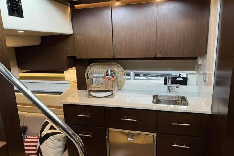 Slide: The Image of Luxurious kitchen interior of 2017 Regal 42 Grande Coupe yacht with modern cabinetry. - 11