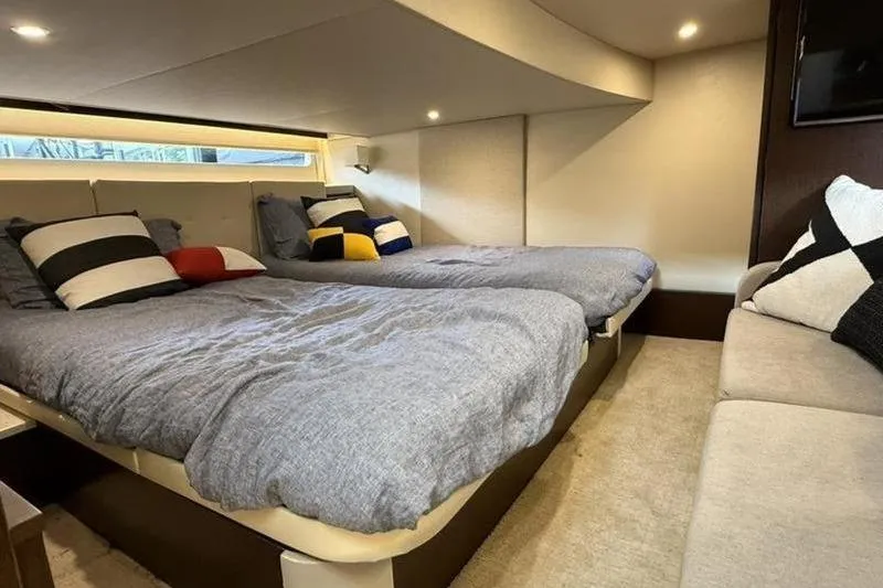 Slide: The Image of Interior cabin of 2017 Regal 42 Grande Coupe with twin beds and modern decor. - 14