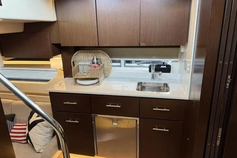 Slide: The Image of Luxurious kitchen area in a 2017 Regal 42 Grande Coupe yacht. - 17