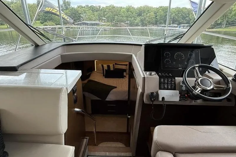 Slide: The Image of Interior view of 2017 Regal 42 Grande Coupe yacht cockpit and cabin. - 18