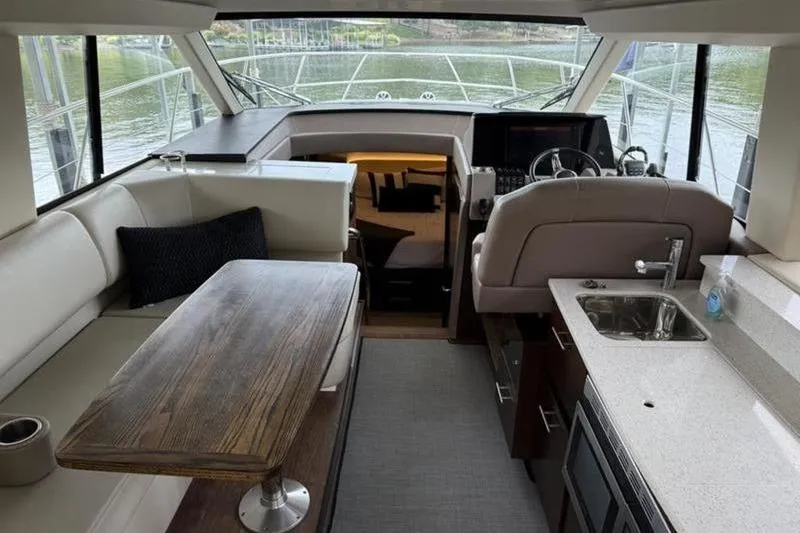 Slide: The Image of Luxurious interior of a 2017 Regal 42 Grande Coupe yacht with modern amenities. - 19