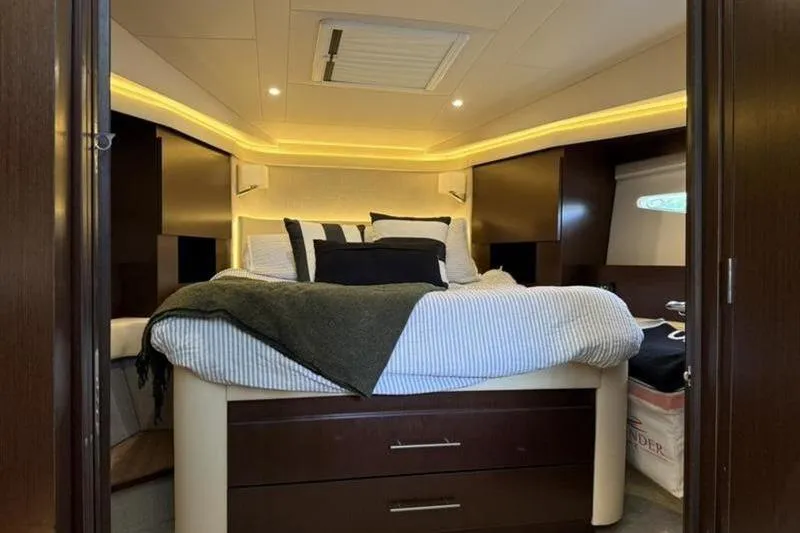 Slide: The Image of Luxurious bedroom interior of 2017 Regal 42 Grande Coupe yacht with elegant lighting. - 22