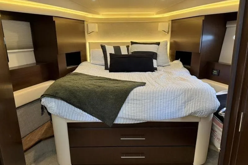 Slide: The Image of Luxurious bedroom interior of 2017 Regal 42 Grande Coupe yacht with cozy bedding. - 23