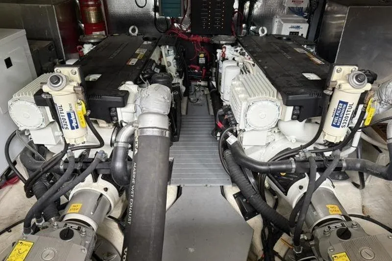 Slide: The Image of Engine room of a 2017 Regal 42 Grande Coupe with twin engines and mechanical components. - 27