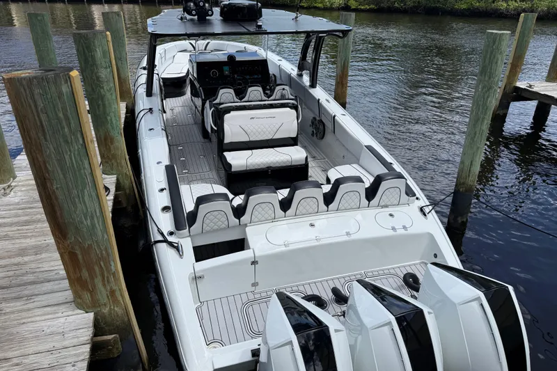 The Image of 2021 Midnight Express 37 Open boat docked, featuring luxurious seating and powerful engines. - 0
