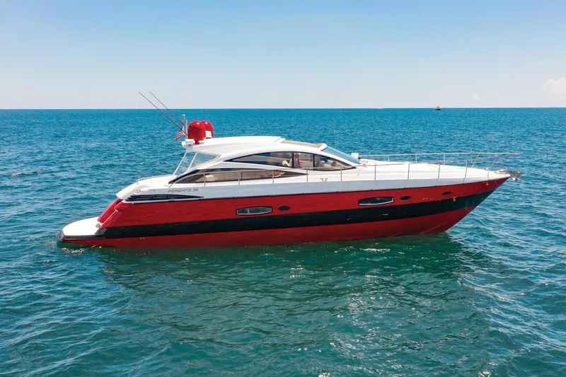 The Image of 2007 Pershing 56 yacht cruising on open sea under clear blue sky. - 0