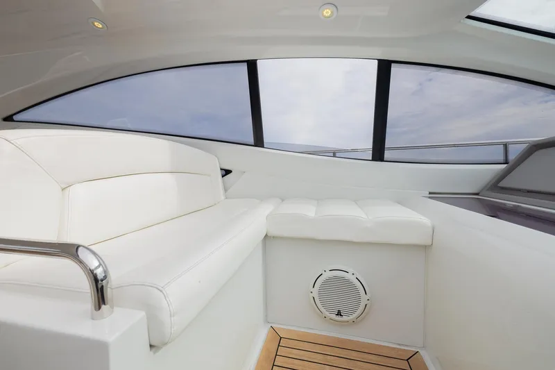 Slide: The Image of Luxurious interior of 2007 Pershing 56 yacht with white seating and panoramic windows. - 10