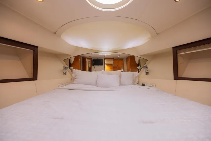 Slide: The Image of Luxurious bedroom interior of a 2007 Pershing 56 yacht with elegant bedding and modern design. - 15