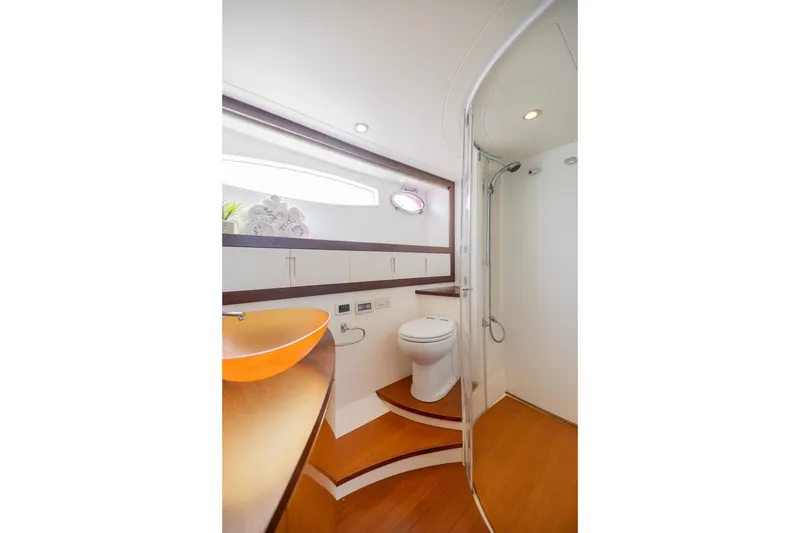 Slide: The Image of Luxurious bathroom in 2007 Pershing 56 yacht with modern fixtures and elegant design. - 18