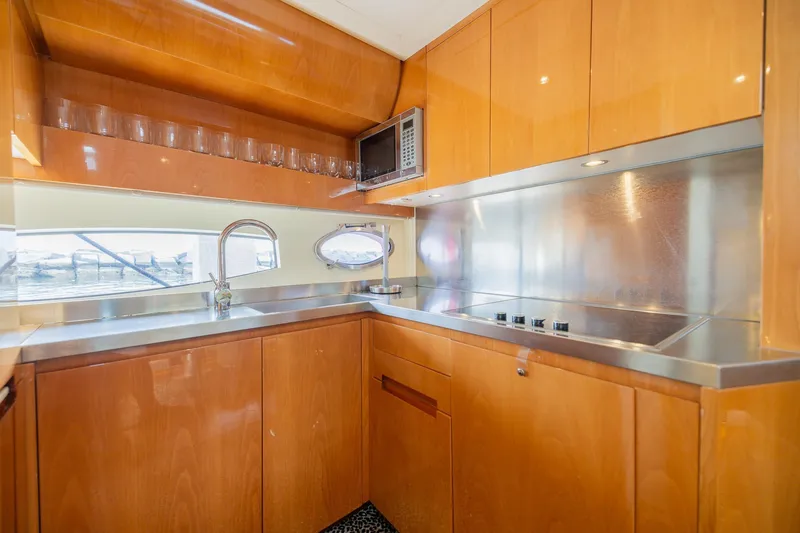 Slide: The Image of Luxurious kitchen interior of 2007 Pershing 56 yacht with modern amenities and sleek design. - 22