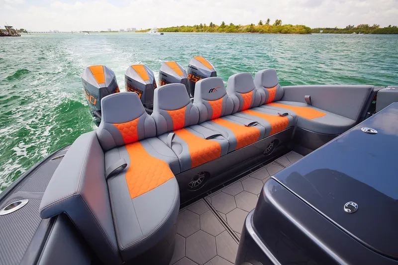 Slide: The Image of 2022 Midnight Express 43 Open boat with luxurious seating and powerful engines on open water. - 17