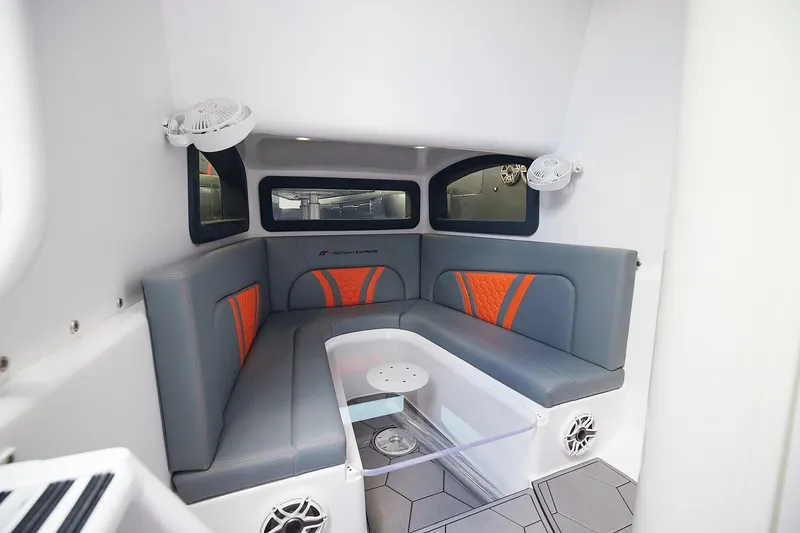 Slide: The Image of Interior of 2022 Midnight Express 43 Open boat with gray and orange seating. - 18