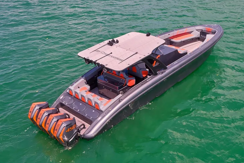 Slide: The Image of 2022 Midnight Express 43 Open boat with quad engines on turquoise water. - 5