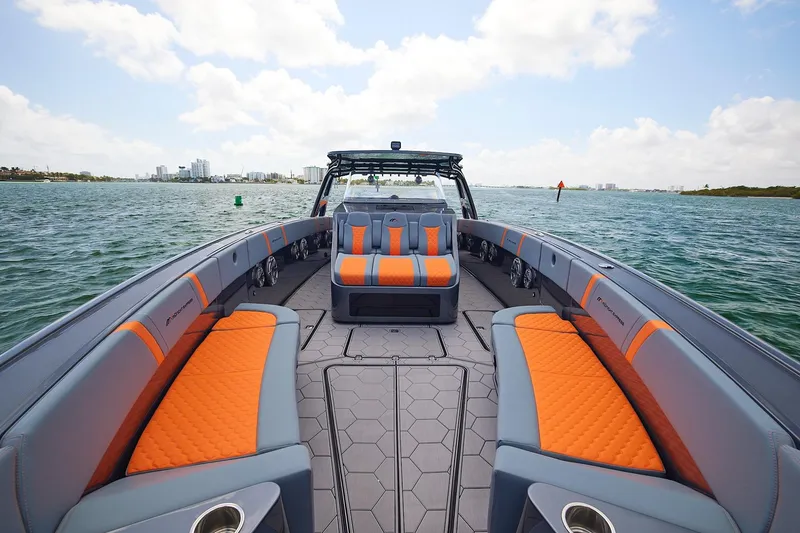 The Image of 2022 Midnight Express 43 Open boat with orange and gray seating on open water. - 7