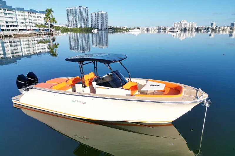 Slide: The Image of 2026 Lilybaeum Lipari 31 boat on calm water, modern design, cityscape background. - 1
