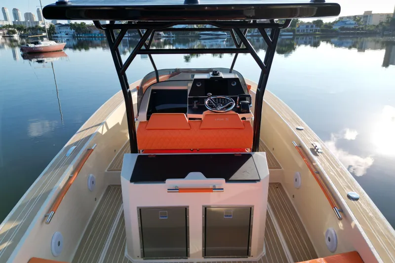 Slide: The Image of 2026 Lilybaeum Lipari 31 boat interior with orange seating, sleek design, and modern controls. - 23