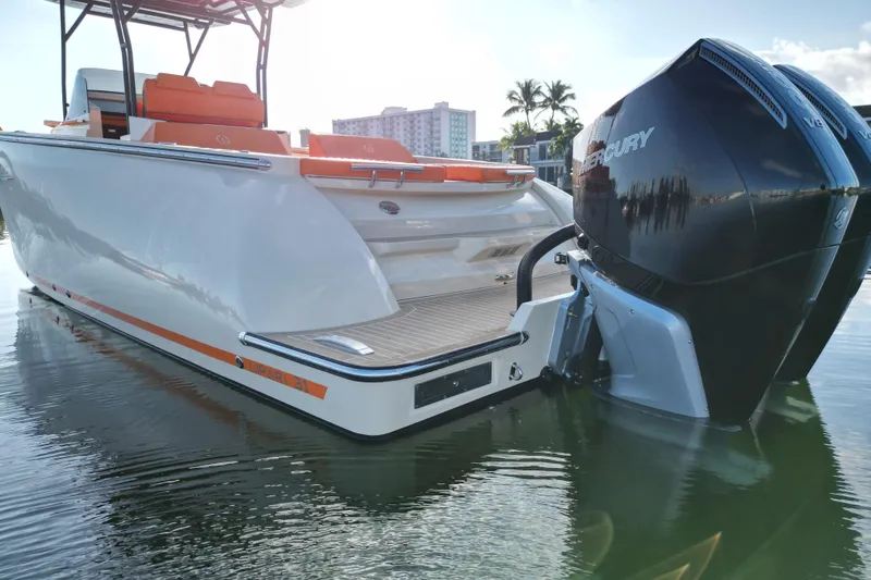 Slide: The Image of 2026 Lilybaeum Lipari 31 boat with dual Mercury engines, docked in calm waters. - 29