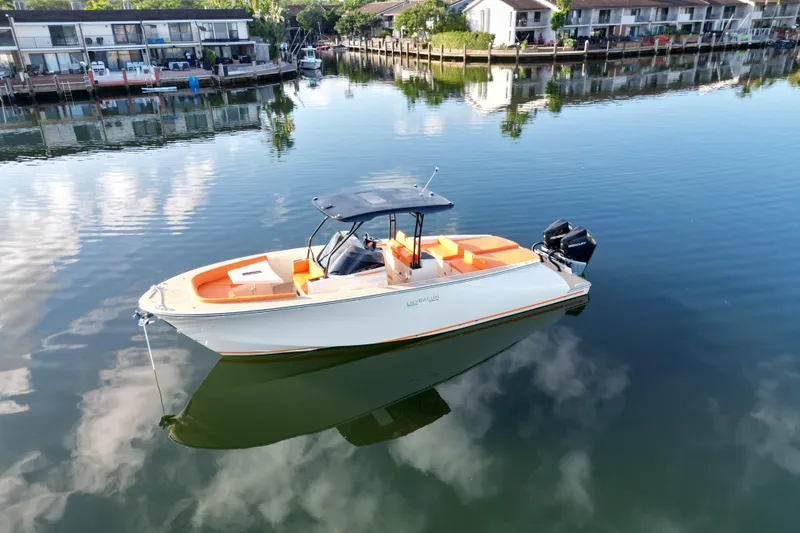 Slide: The Image of 2026 Lilybaeum Lipari 31 boat on calm water near waterfront homes. - 7