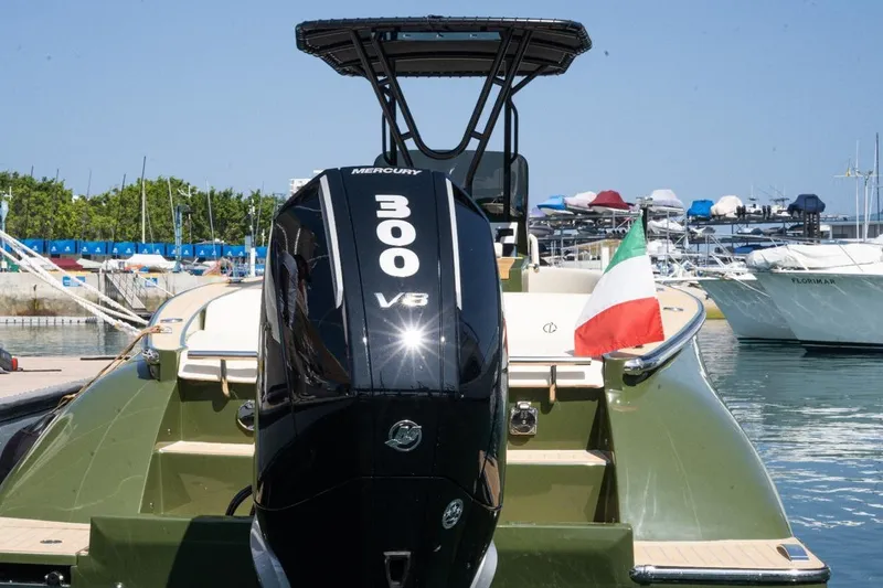 Slide: The Image of 2026 Lilybaeum Levanzo 25 Lounge Deck boat with Mercury 300 V8 engine, Italian flag displayed. - 14