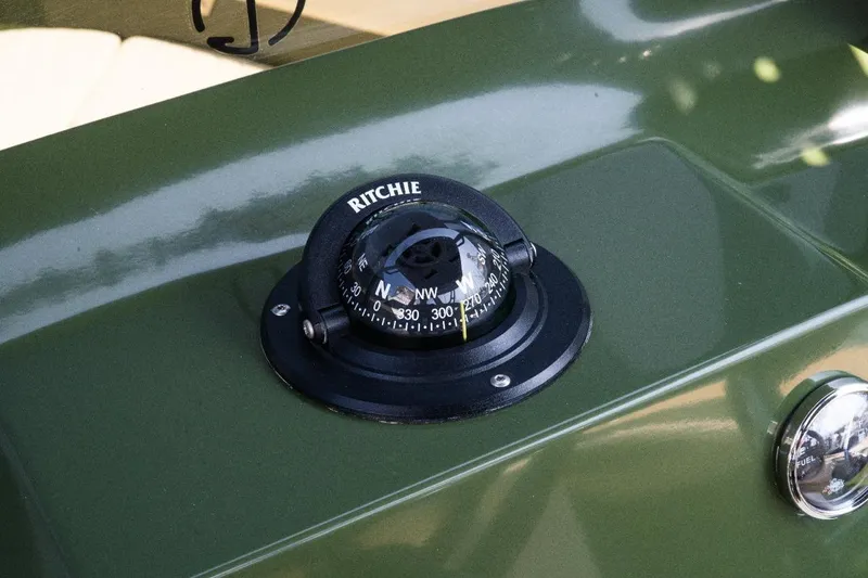 Slide: The Image of Compass on Lilybaeum Levanzo 25 Lounge Deck, 2026 model, green dashboard. - 6