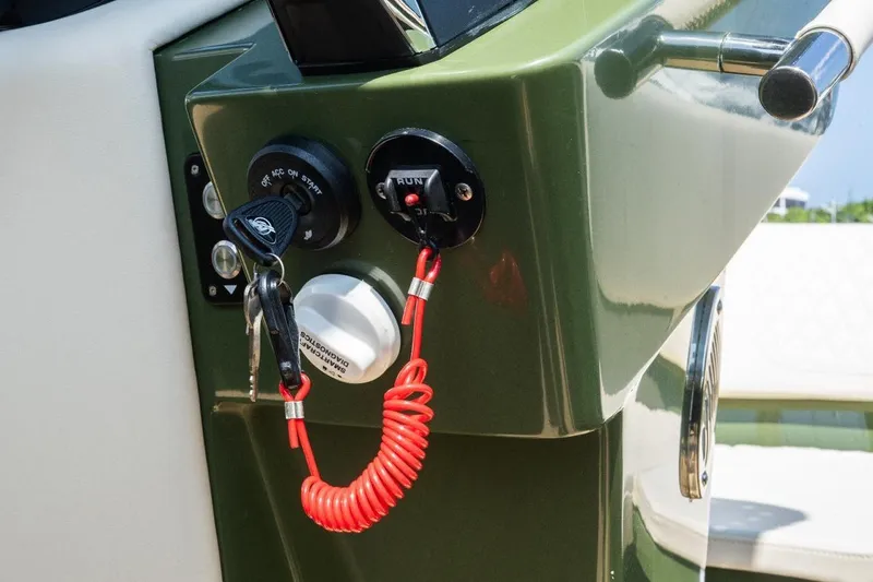 Slide: The Image of Control panel of Lilybaeum Levanzo 25 Lounge Deck, featuring ignition keys and safety lanyard, 2026 model. - 7