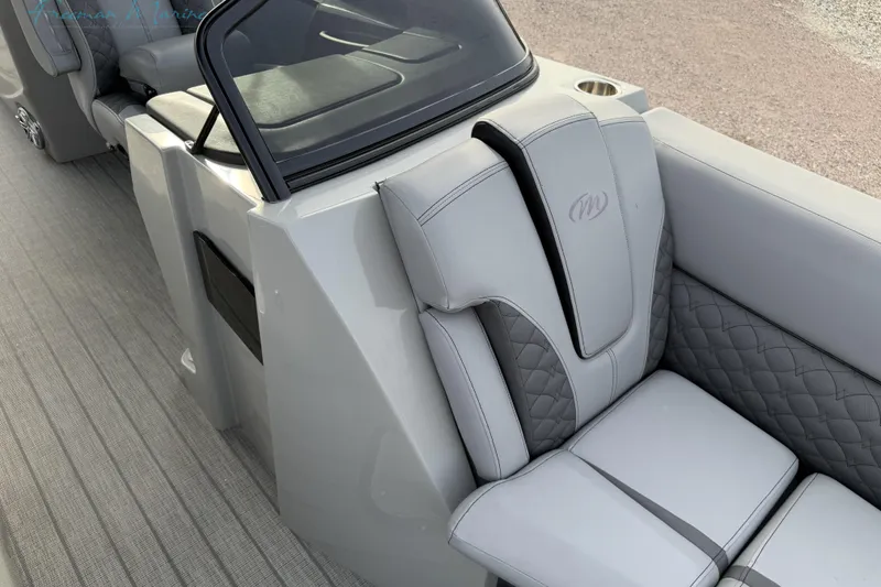 Slide: The Image of Luxurious seating on 2022 Manitou 27 LX SRW boat with sleek design and premium materials. - 13