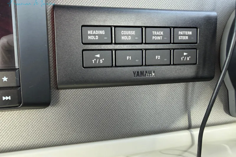 Slide: The Image of Control panel of a 2022 Manitou 27 LX SRW with Yamaha navigation buttons. - 28