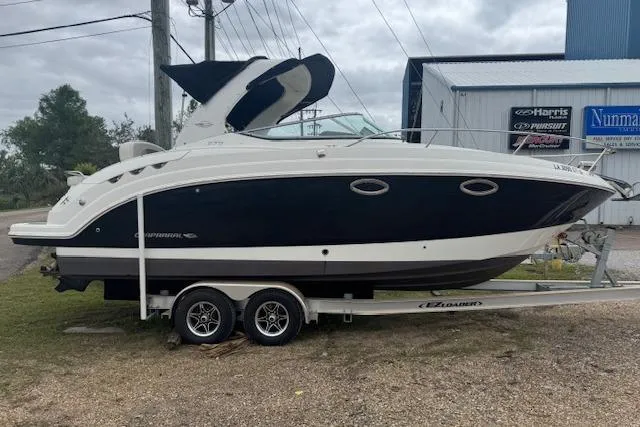 The Image of 2011 Chaparral 270 Signature boat on trailer, parked outdoors near a building. - 0