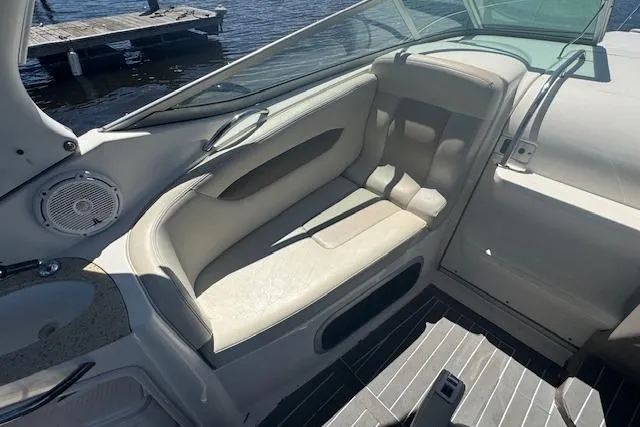 Slide: The Image of Interior seating of 2011 Chaparral 270 Signature boat with beige upholstery. - 10