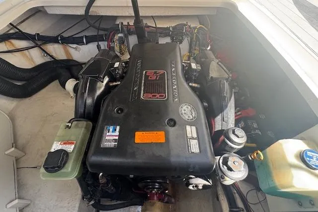 Slide: The Image of Engine compartment of 2011 Chaparral 270 Signature boat, featuring a powerful engine. - 19