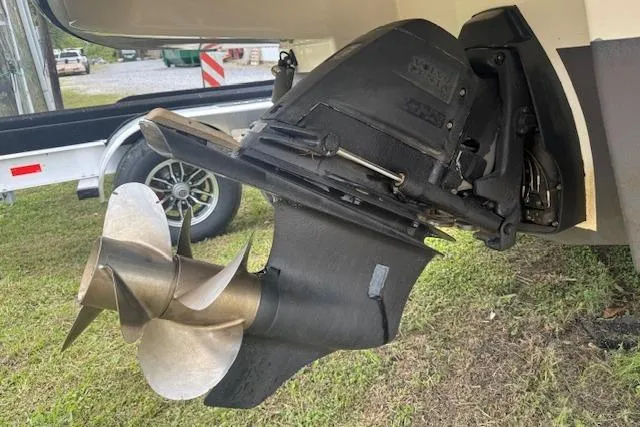 Slide: The Image of 2011 Chaparral 270 Signature boat propeller and outdrive on grass. - 22