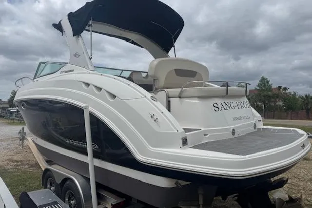 Slide: The Image of 2011 Chaparral 270 Signature boat on trailer, featuring sleek design and spacious deck. - 23