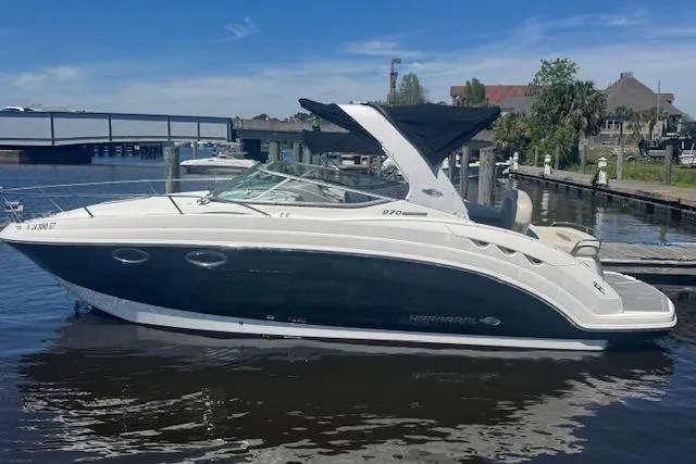 Slide: The Image of 2011 Chaparral 270 Signature boat docked on a sunny day. - 3