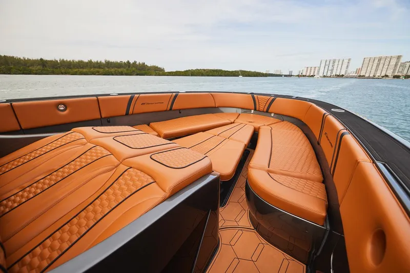 Slide: The Image of Luxurious interior of 2024 Midnight Express 43 Solstice boat with tan leather seating. - 12