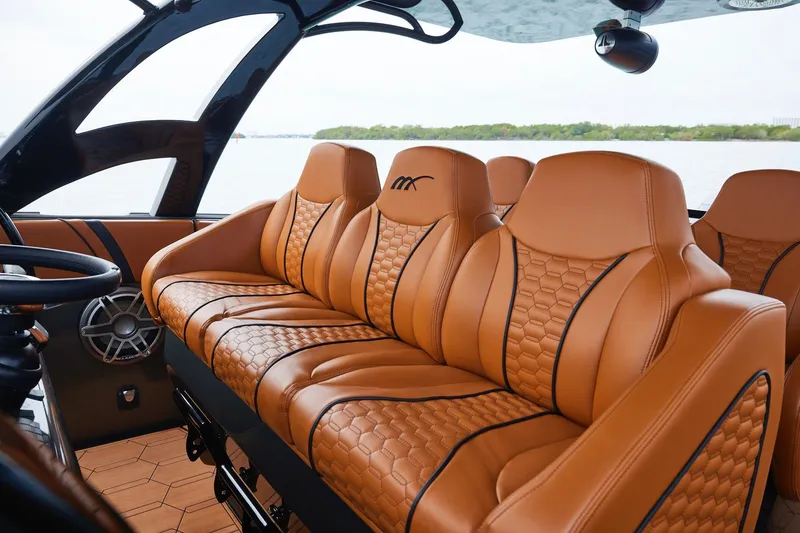 Slide: The Image of Luxurious leather seating in 2024 Midnight Express 43 Solstice boat interior. - 16